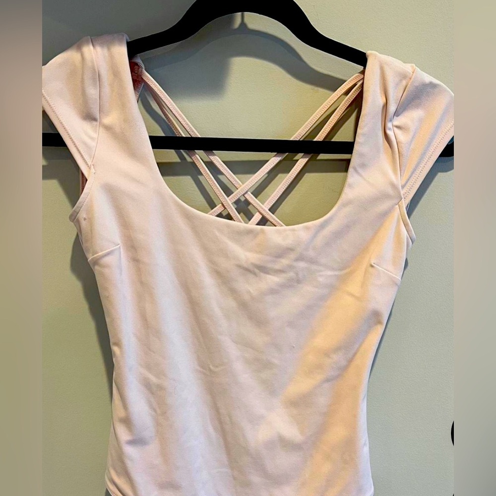 Garage Cross back Bodysuit. Color: Light Pink
